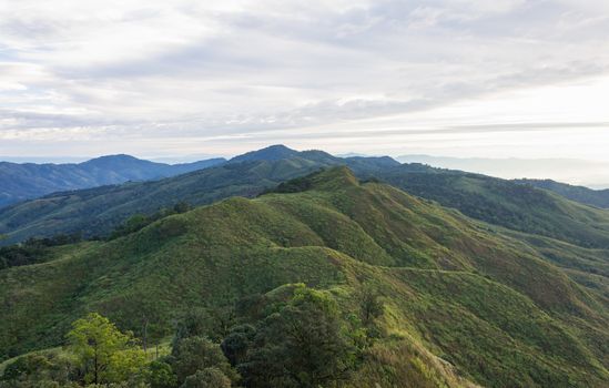 Landscape Phu Langka Mountain National Park View Point Phayao Thailand Travel with Tree. Green tree mountain and cloud sky and warm sun light at Phu Langka national park view 
point Phayao Thailand. Northern Thailand travel