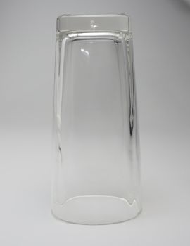 Empty glass Upside down on a white background.