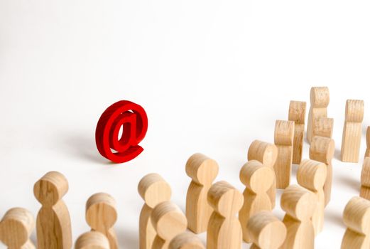 A large crowd of people looking at an email icon on a white background. The concept of e-mail and the Internet, communication and communication. Firewall, Internet restriction and censorship
