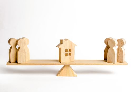 Two groups of people on the scales are suing the house. Conflict of interests and claims regarding the ownership of house. Illegal seizure of property, the return of the acquired house fraudulently