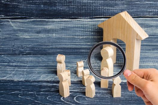 Magnifying glass is looking at the children gathered around the teacher. Lesson from the teacher, school lesson. The system of education, the process of teaching students and children, instruction.