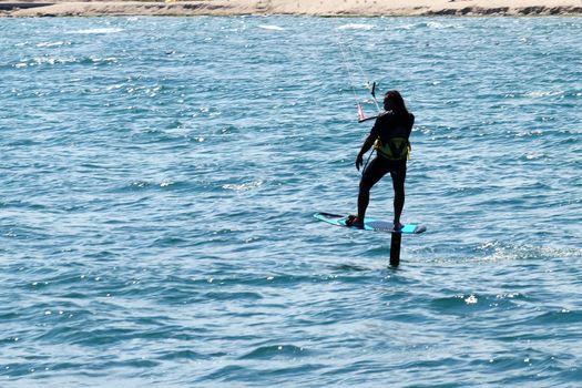 Varna, Bulgaria - July, 19, 2020: a man is kiting the sea