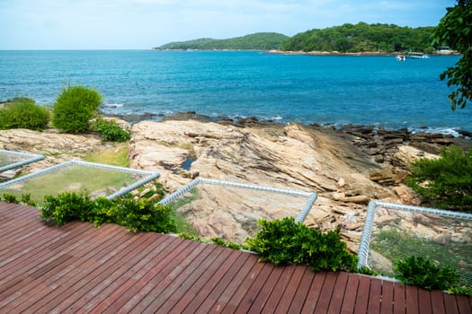 Balcony view of the seaside resort and rope bed