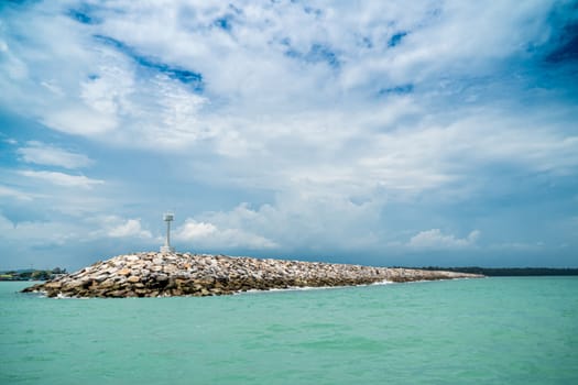 The breakwater line is constructed from rock in the sea.