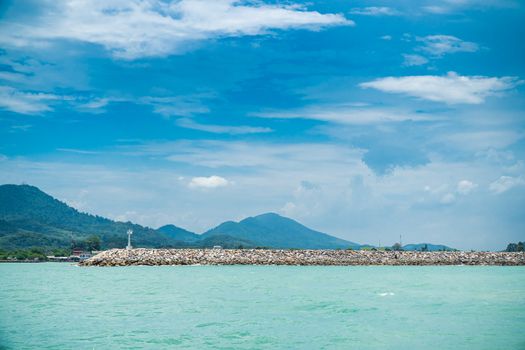 The breakwater line is constructed from rock in the sea