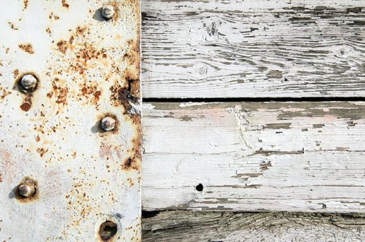 Old white painted rust weathered distressed iron and wood oak plank board background stock photo