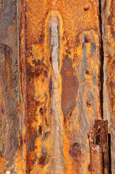 Rusty background texture close up of old distressed weathered iron panel covered in rust stock photo