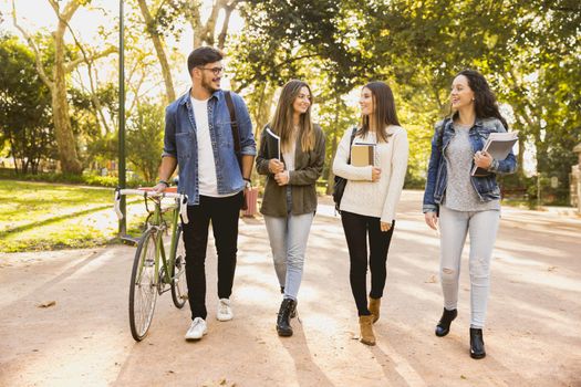 Group of students walking together in the park