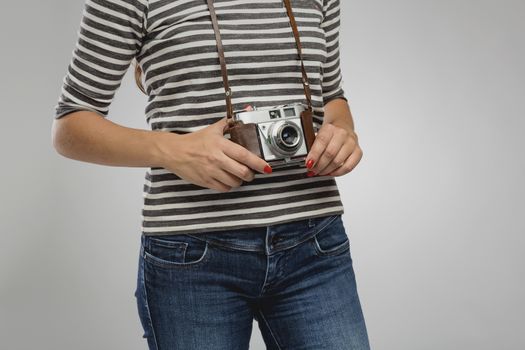 Woman holding a vintage camera