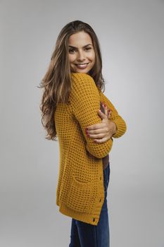 Shot of a beautiful young woman over a gray background