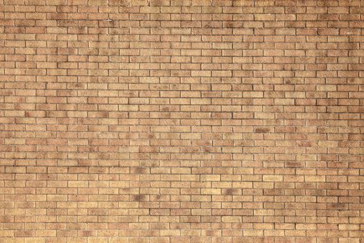 Modern large yellow brick wall texture background stock photo