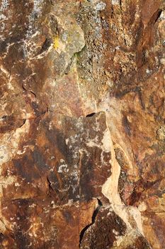 Stone weathered brown surface texture background of rough rock stock photo