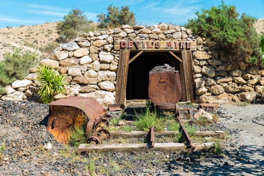 Entrance to a mining shaft with old timbers