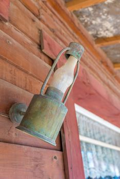 Vintage outdoor garden street wall metal electrical lamp in town or village