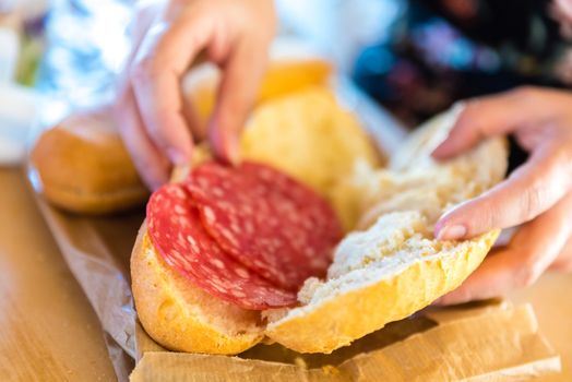 woman preparing sandwich