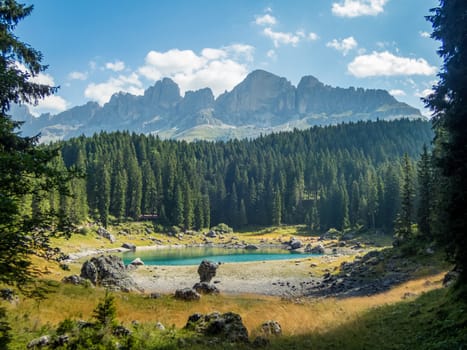 The Karersee below the Karerpass at the foot of the Latemar massif in South Tyrol, Italy