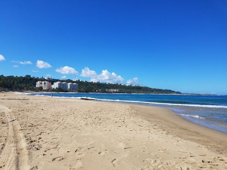 sand and ocean or sea water on beach in Isabela, Puerto Rico