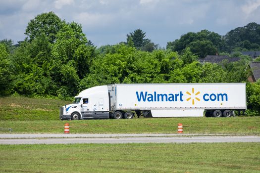 6/26/2020 -- Maryville, TN -- A Walmart tractor-trailer on its way to a store.  The heat waves from the pavement creates a slight shimmering effect on the truck and the background foliage.