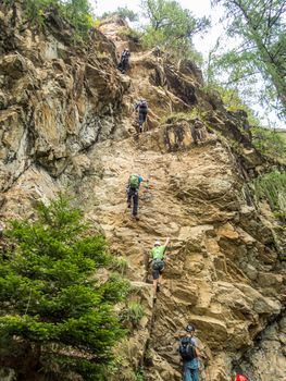 Climbing at the Lehner Waterfall via ferrata near Oberried in the Otztal, Tyrol, Austria