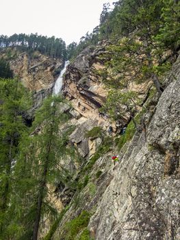 Climbing at the Lehner Waterfall via ferrata near Oberried in the Otztal, Tyrol, Austria