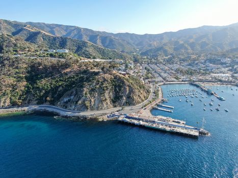 Aerial view of Avalon downtown and bay with boats in Santa Catalina Island, famous tourist attraction in Southern California, USA