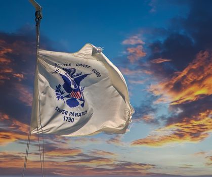 The United States Coast Guard Flag Blowing on a Blue Sky