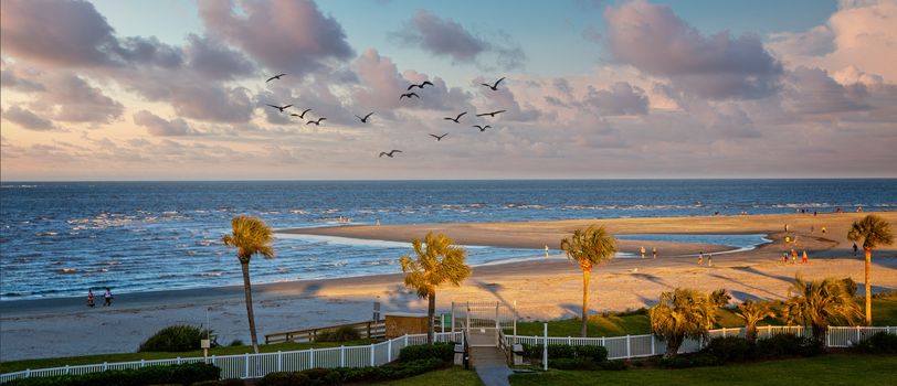 View of a late afternoon beach from coastal condo balcony