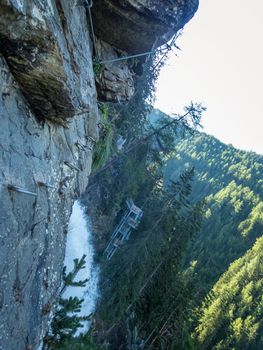 Climbing on the Stuibenfall via ferrata near Umhausen in the Otztal, Tyrol, Austria