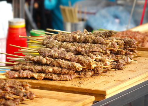 A street food stall in Taiwan offers meat skewers with Mideast spices