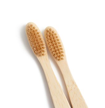 two wooden toothbrushes on a white background, plastic rejection concept, zero waste 