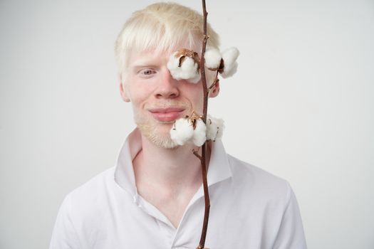 albinism Happy smile albino man white skin hair soft fluffy cotton brunch studio dressed t-shirt isolated white background abnormal deviations unusual appearance abnormality Beautiful people