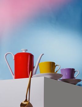 Geyser coffee maker and red cup for coffee shop stand on a white cube. High quality photo