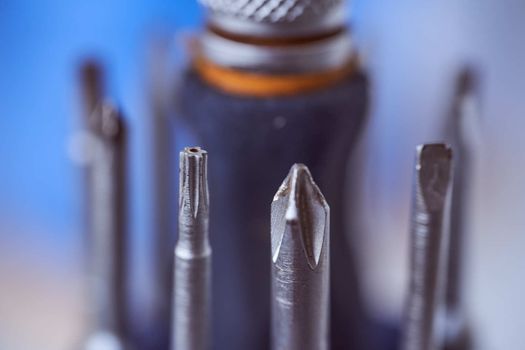 set of screwdrivers on blue blurred background. Close-up. High quality photo