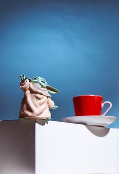 Geyser coffee maker and red cup for coffee shop stand on a white cube. High quality photo