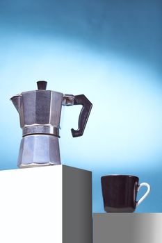 Geyser coffee maker and black cup for coffee shop stand on a white cube. High quality photo