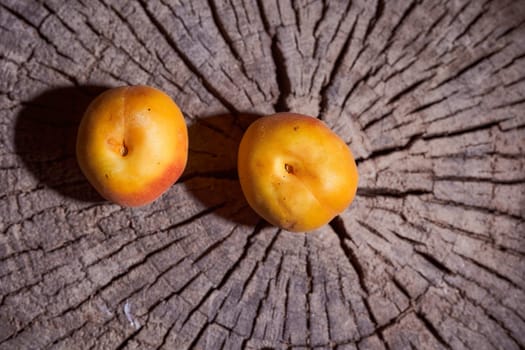 ripe apricots lie on the wooden frame. High quality photo