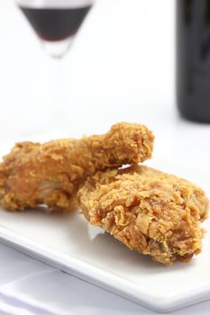 fried chicken and wine  isolated in white background