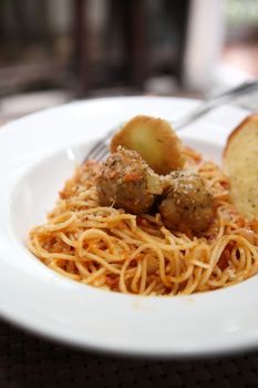 Spaghetti  Meatballs on wood background