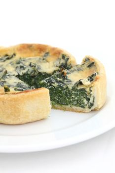 spinach quiche pie isolated on white background