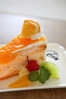 Orange cake on wood background