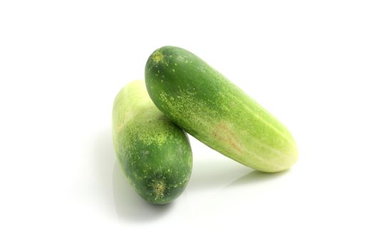 small cucumber isolated in white background