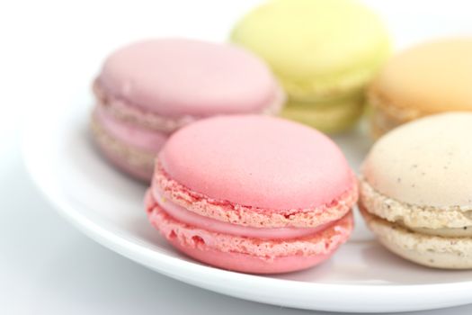 Colorful Macaron in close up isolated on white background