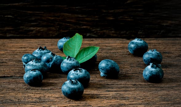 Blueberry fruit on the old wooden floor