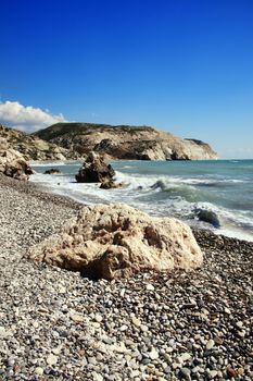 Aphrodite's Rock Cyprus a popular travel destination coastline landmark shoreline showing the Mediterranean Sea with a blue sky and sea stock photo