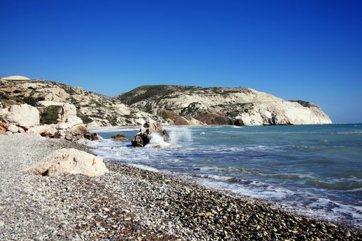 Aphrodite's Rock Cyprus a popular travel destination coastline landmark shoreline showing the Mediterranean Sea with a blue sky and sea stock photo
