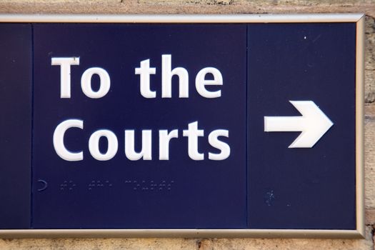 To the law courts blue direction arrow sign stock photo