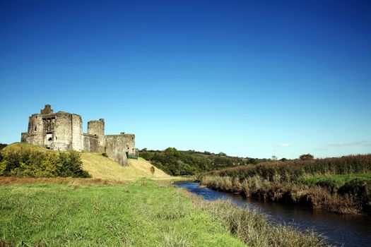 Kidwelly Castle Carmarthenshire Wales UK is a ruin of a 13th century medieval castle and a popular travel destination landmark of the town stock photo