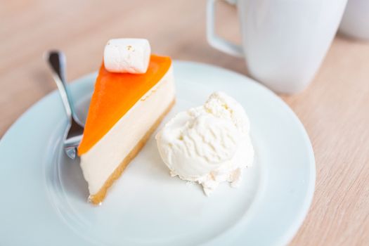 A piece of delicious original cheesecake served with ice cream