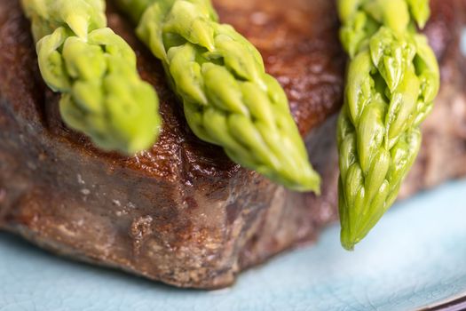 asparagus with potatoes and a steak