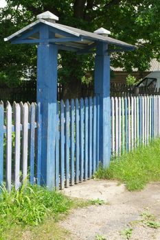 Wooden big gate of vintage wooden house, ancient architecture with ornamental carved frames, Belarus